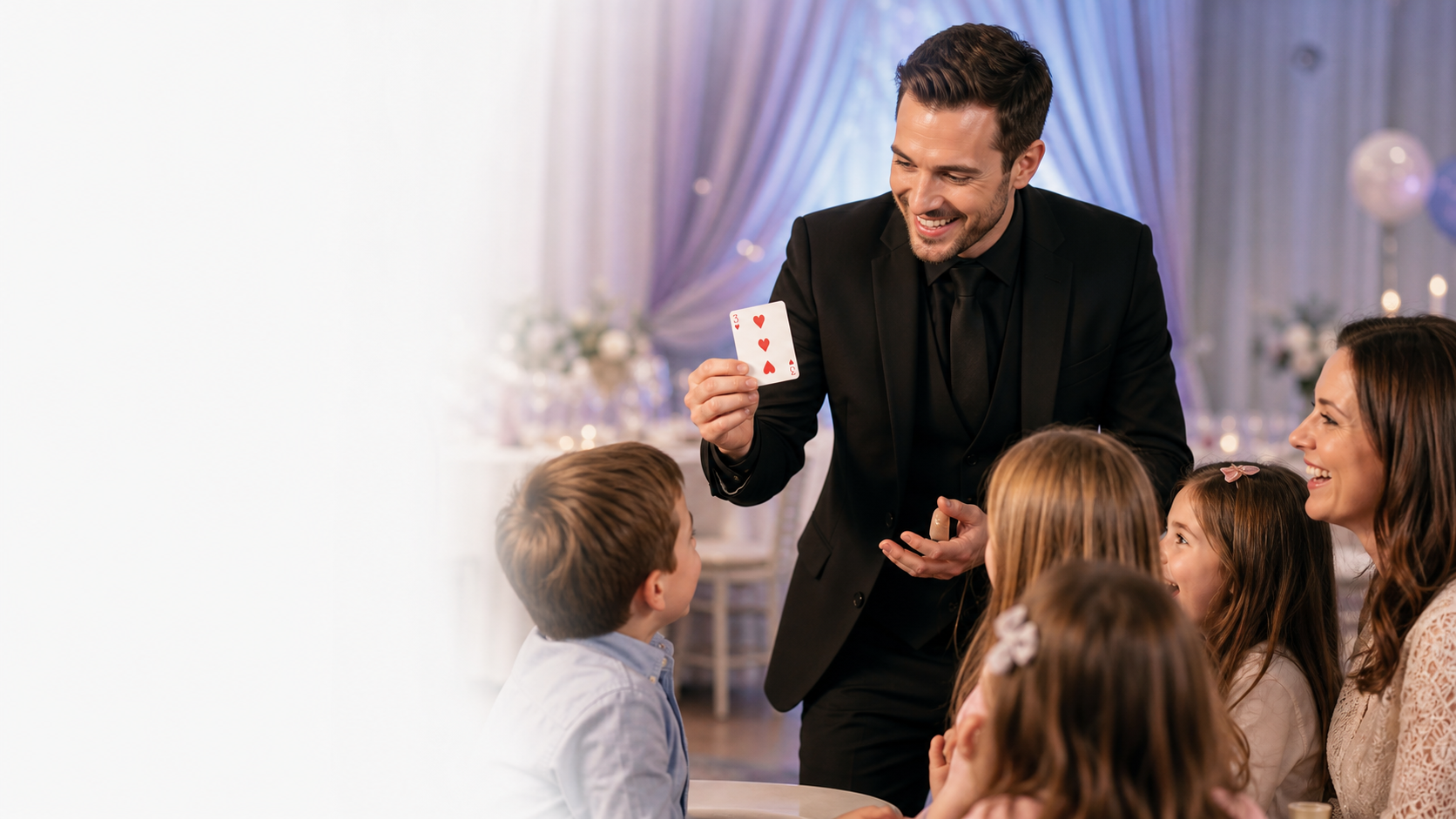 A magician performing card magic for a family event